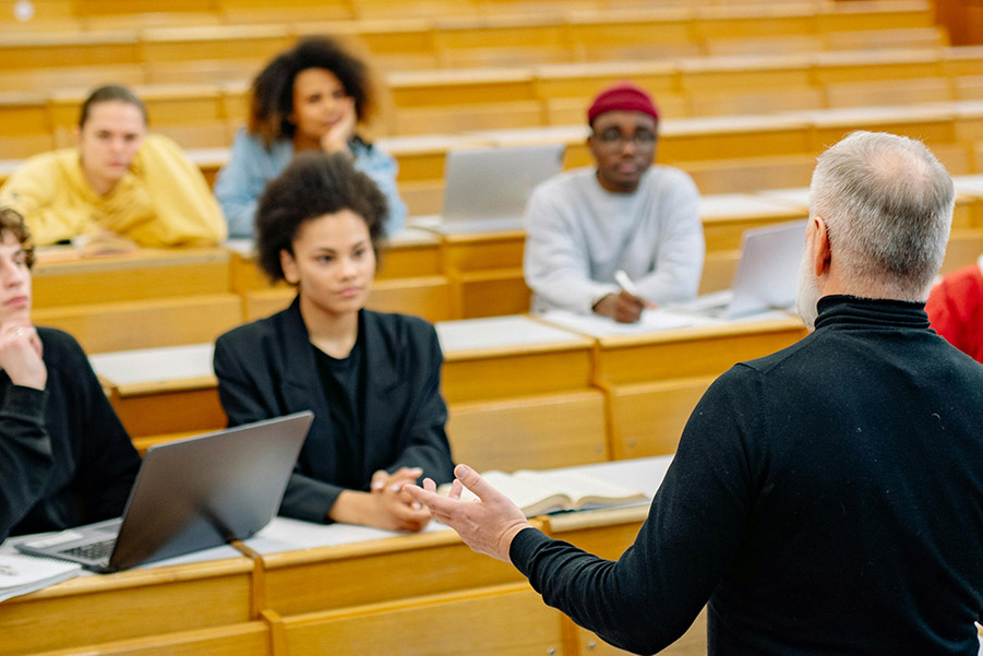 college professor in a classroom lecturing students